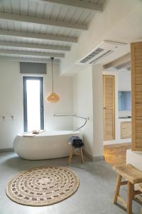 A bed or beds in a room at Yacht Boheme Hotel-Boutique Class - Adults Only