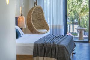 A bed or beds in a room at Yacht Boheme Hotel-Boutique Class - Adults Only