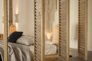 A bed or beds in a room at Yacht Boheme Hotel-Boutique Class - Adults Only