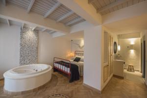 A bed or beds in a room at Yacht Boheme Hotel-Boutique Class - Adults Only