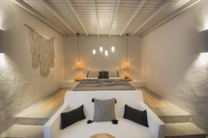 A bed or beds in a room at Yacht Boheme Hotel-Boutique Class - Adults Only