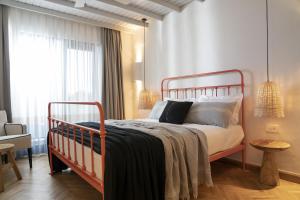 A bed or beds in a room at Yacht Boheme Hotel-Boutique Class - Adults Only