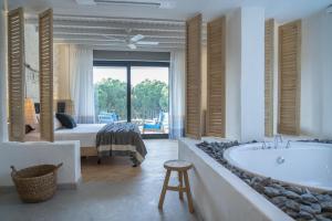 A bed or beds in a room at Yacht Boheme Hotel-Boutique Class - Adults Only