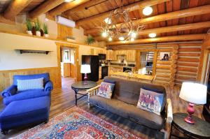 a living room with a couch and a table at Paddle Ridge in West Glacier