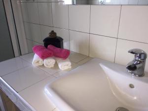 a bathroom counter with two towels and a sink at Sermar in Rabo de Peixe +56 photos