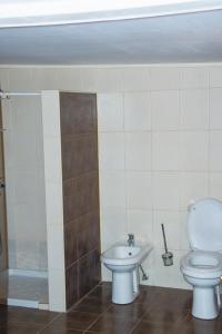 a bathroom with a toilet and a sink at Mara in Zaječar