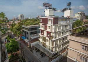 an overhead view of a building on a city street at South Gate Residency in Cochin