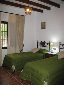 Un pat sau paturi într-o cameră la Casa Encina - Encinasola Turismo Rural.