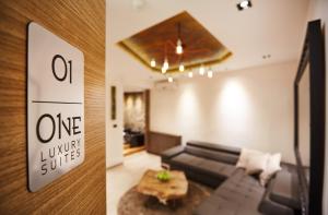 a living room with a couch and a table at One Luxury Suites in Belgrade