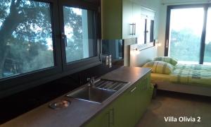 Postel nebo postele na pokoji v ubytování Villa Olivia