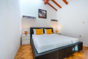 Posteľ alebo postele v izbe v ubytovaní Beach Lapad Apartment Villa Tolja