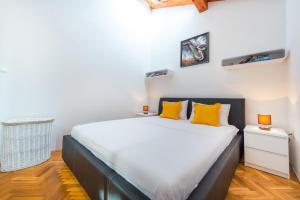 Posteľ alebo postele v izbe v ubytovaní Beach Lapad Apartment Villa Tolja