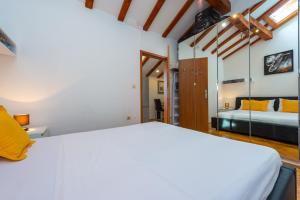 Posteľ alebo postele v izbe v ubytovaní Beach Lapad Apartment Villa Tolja