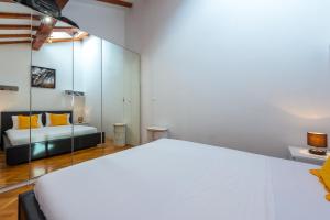 Posteľ alebo postele v izbe v ubytovaní Beach Lapad Apartment Villa Tolja