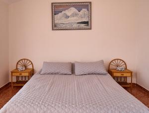 מיטה או מיטות בחדר ב-Casa En La Playa Del Rey
