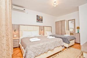 Krevet ili kreveti u jedinici u objektu Apartments Obala - Katić