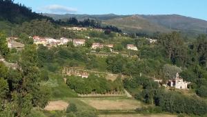 an aerial view of a village in the mountains at apartamento en el rural Mariela in Covelo