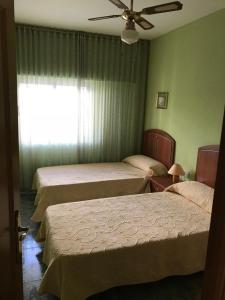 A bed or beds in a room at Piso ideal para las vacaciones
