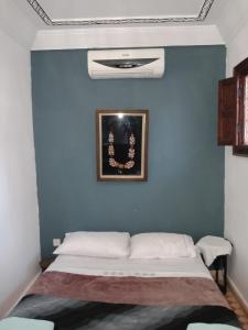 Postel nebo postele na pokoji v ubytování Riad Naya