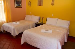 Rúm í herbergi á Hotel Kuntur Wassi