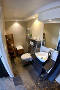 a bathroom with a sink and a toilet at Hamrar in Einarsstaðir
