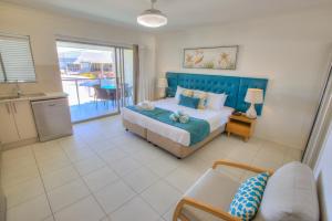 Кровать или кровати в номере 1770 Lagoons Central Apartment Resort Official