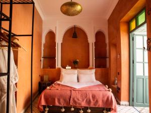 Postel nebo postele na pokoji v ubytování Riad Orange