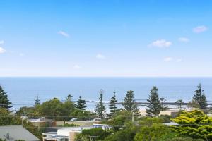 a view of the ocean from a house at Whitewater Apartment 101 in Torquay