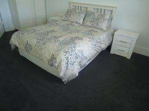 Ένα ή περισσότερα κρεβάτια σε δωμάτιο στο Tripinn Hostel Backpackers YHA