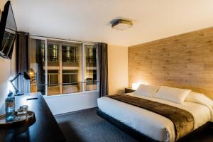 Postel nebo postele na pokoji v ubytování Hotel Viza