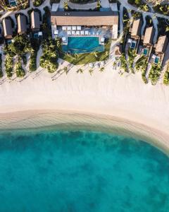 an aerial view of the beach and the ocean at Six Senses Fiji in Malolo