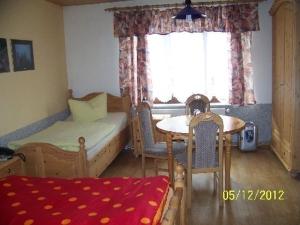 מיטה או מיטות בחדר ב-Pension Strohbach