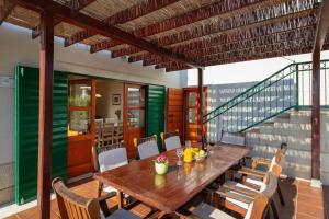 a dining room with a wooden table and chairs at Villa Liza 70 m away from sea - DIRECT LANDLORD in Hvar