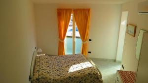 Katil atau katil-katil dalam bilik di Villa Flora Ischia