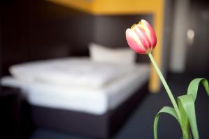 Postel nebo postele na pokoji v ubytování GS Hotel Mindelheim
