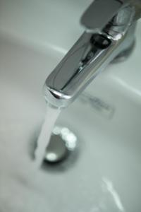 a close up of a faucet with a spoon at SAGA Pension in Gythio