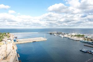 an aerial view of a harbor with boats in the water at The Marine Plaza - Sea Towers in Gdynia
