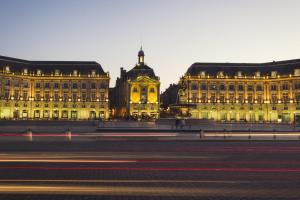 a large building is lit up at night at Best Hotel Bordeaux Sud in Villenave-dʼOrnon