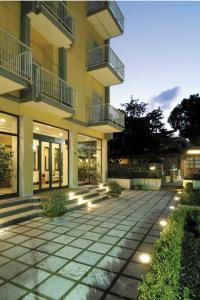 a building with a walkway in front of it at American Hotel in Pozzuoli