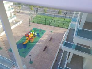 an aerial view of a playground on a building at Apartamento playa Piles in Piles