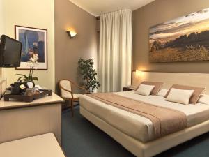 Voodi või voodid majutusasutuse Hotel Ristorante Alcide toas