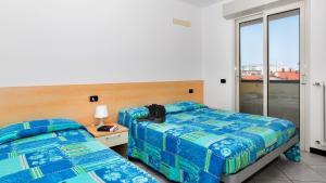 Ένα ή περισσότερα κρεβάτια σε δωμάτιο στο Residenza Angel
