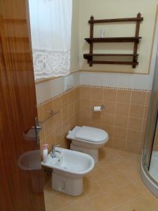 a bathroom with a toilet and a sink at "Da Alma" Centro Storico in Fano +13 photos