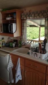 ครัวหรือมุมครัวของ Mobil home vacances