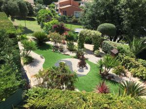 an aerial view of a garden with plants and bushes at Renoir Appartement in Cagnes-sur-Mer