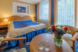 Postel nebo postele na pokoji v ubytování Hotel Polaris