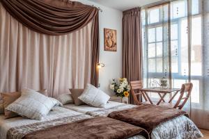 Säng eller sängar i ett rum på O Castelo