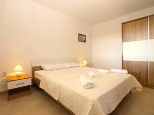 Postel nebo postele na pokoji v ubytování Apartment 1215