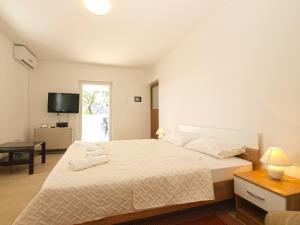 Postel nebo postele na pokoji v ubytování Apartment 1215
