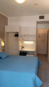 Posteľ alebo postele v izbe v ubytovaní Hotel Acapulco
